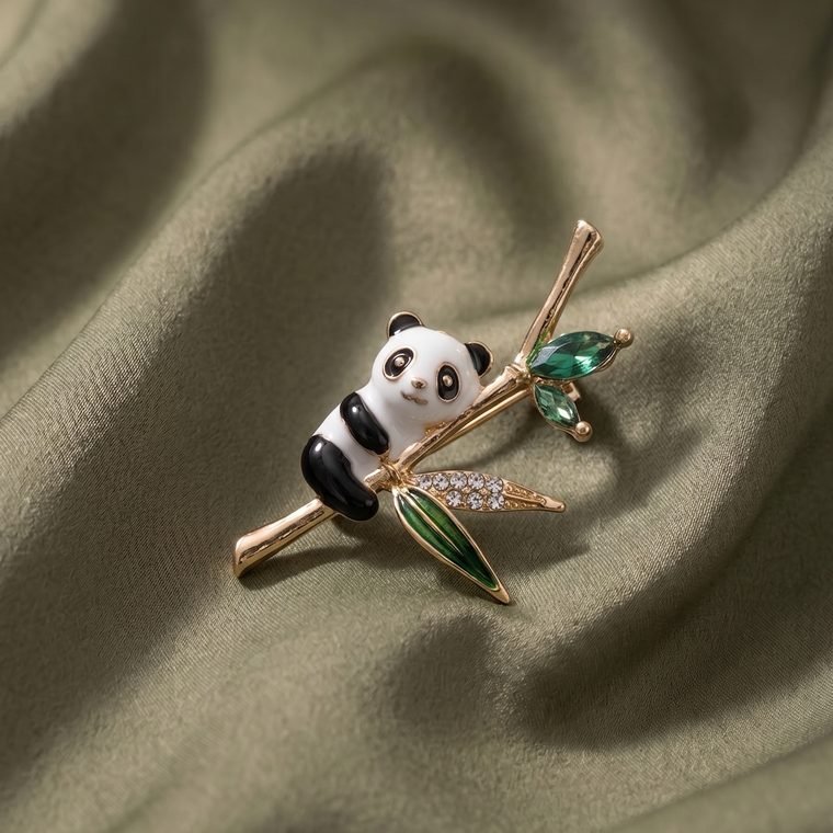 Panda Bambou Brooch — enamelled panda brooch on gold bamboo with green crystals