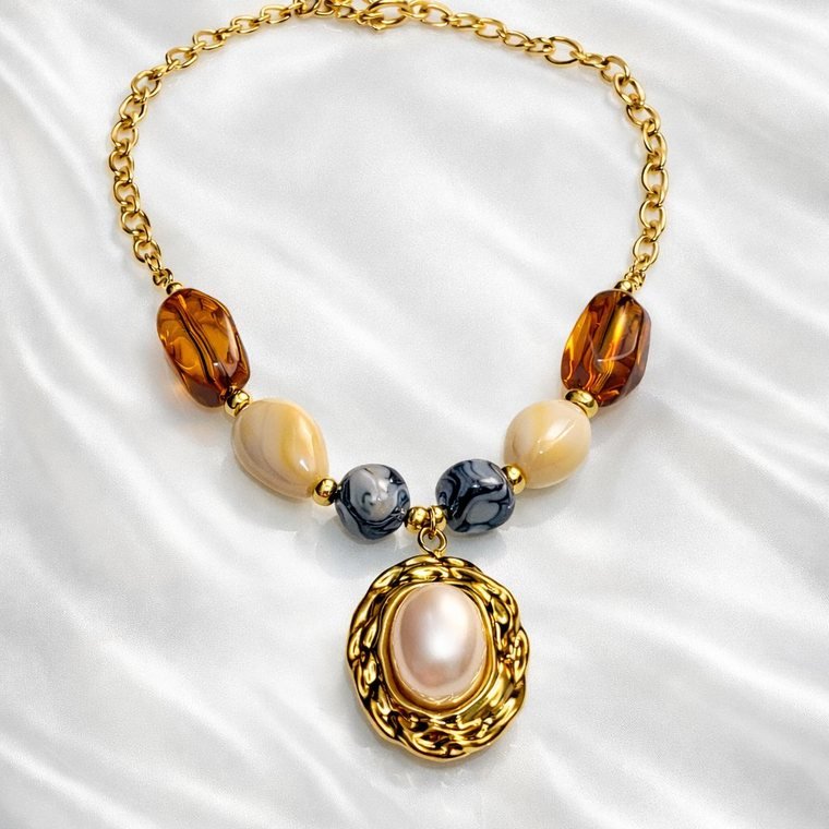 Perle Médaillon Necklace — amber and cream beaded necklace with pearl medallion
